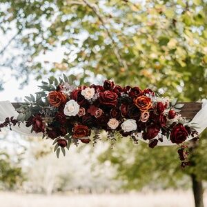 Weddings bouquets with burgundy and rust orange flowers